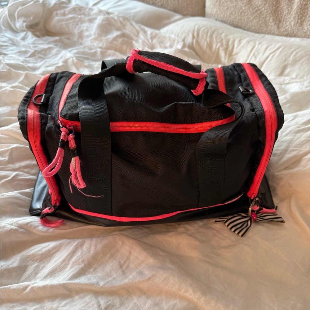 Black and pink TNA Duffel Bag